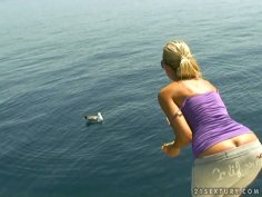 Obedient housewife Sandy takes a sun bath on the boat topless